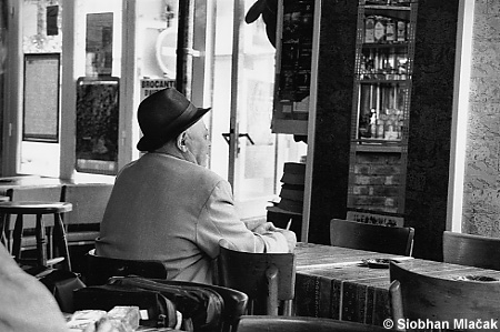 Old Man in Café